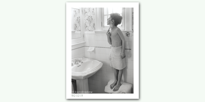 photograph of boy shaving
