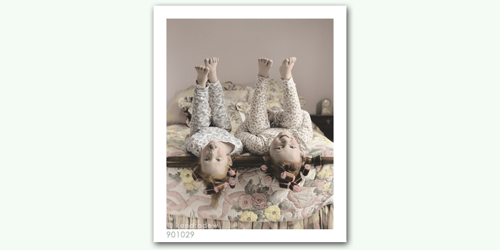 photograph of girls on bed