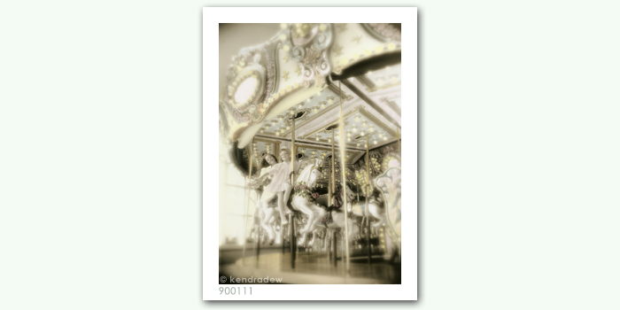 photograph of girls on carousel