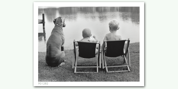 photograph of boys by lake
