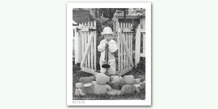 photograph of boy with horn