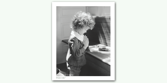 photograph of girl praying