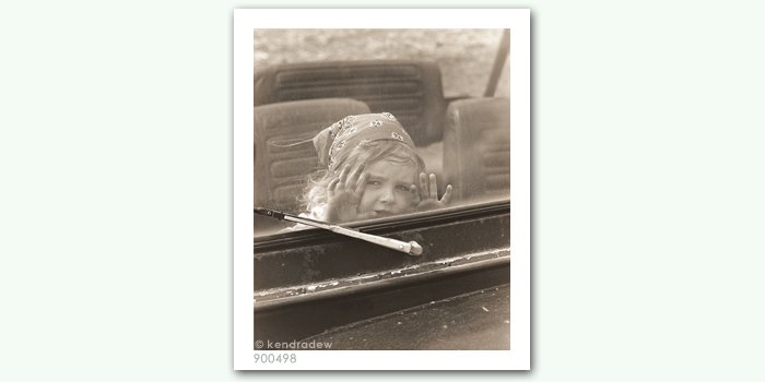 photograph of girl through window