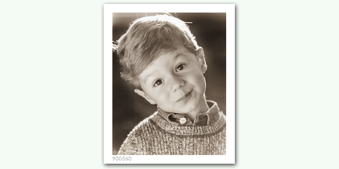 photograph of boy in sweater