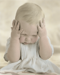 photograph of baby holding head