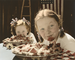 photograph of girls eating pie