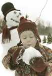 photograph of girl with snowman