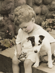 photograph of boy and dog