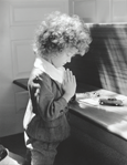 photograph of girl praying