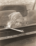 photograph of girl through window