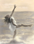 photograph of girl dancing in water