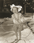 photograph of girl jumping rope