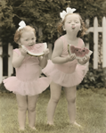 photograph of girls eating melon