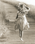 photograph of girl on boardwalk