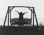 photograph of boy on swing